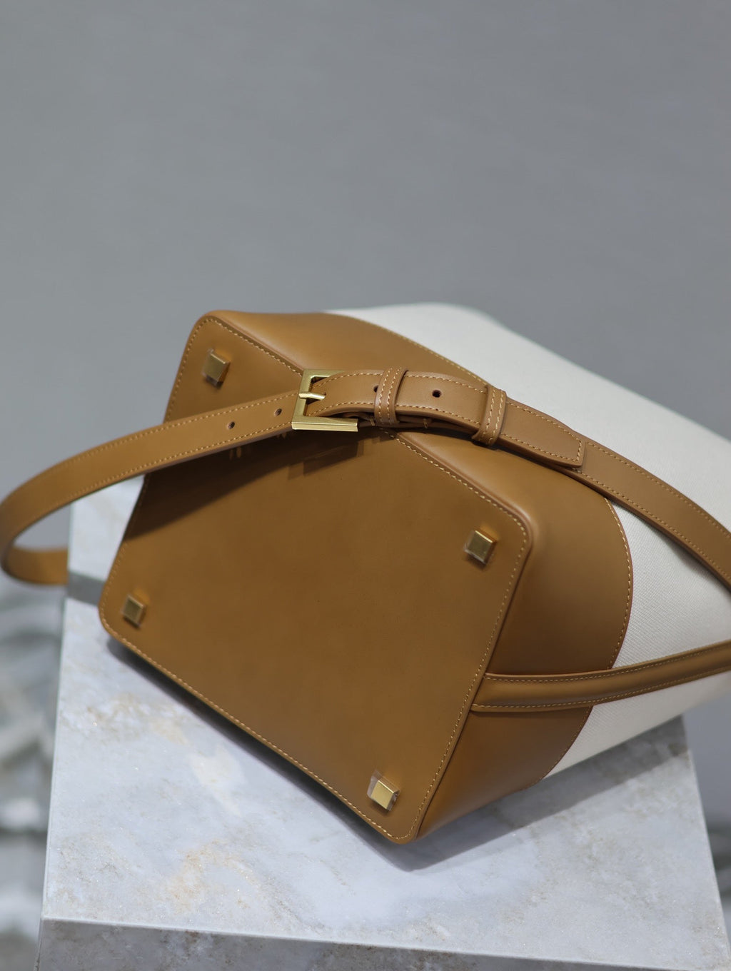 YSL 25S LE 5 À 7 BUCKET 26 IN CREAM BROWN CALFSKIN AND CANVAS GOLD HARDWRE